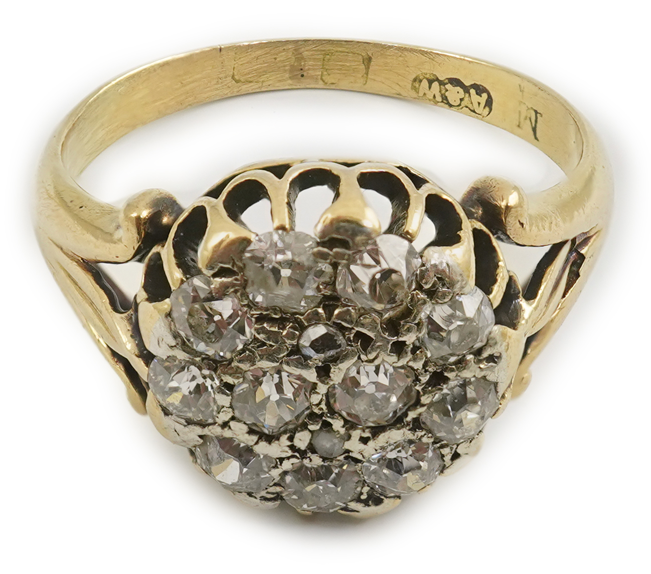 An early to mid 20th century gold and diamond set circular cluster ring